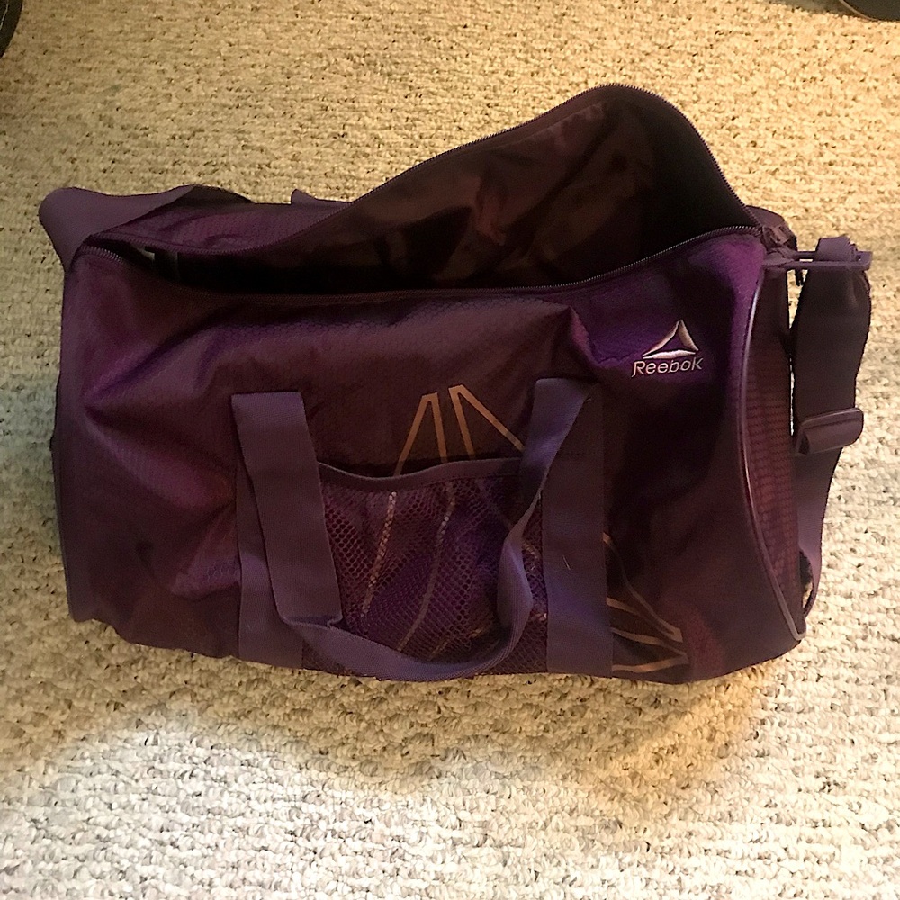 Small purple Reebok duffel bag (estimated 20-30L capacity), good for athletes